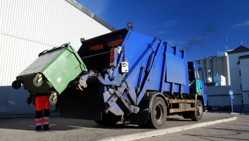 Staff training and compliance meeting at skip hire depot